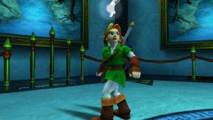 Link in a Green Tunic and Brown Boots Stands in a Blue Gallery like Room with Green Posts