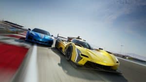 Two High performance Race Cars Race Side by Side on a Racetrack the Yellow Car in Front and the Blue Car Closely Behind with Motion Blur and Red and white Curbs in the Foreground